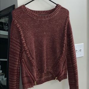 Maroon knit sweater with accent zippers